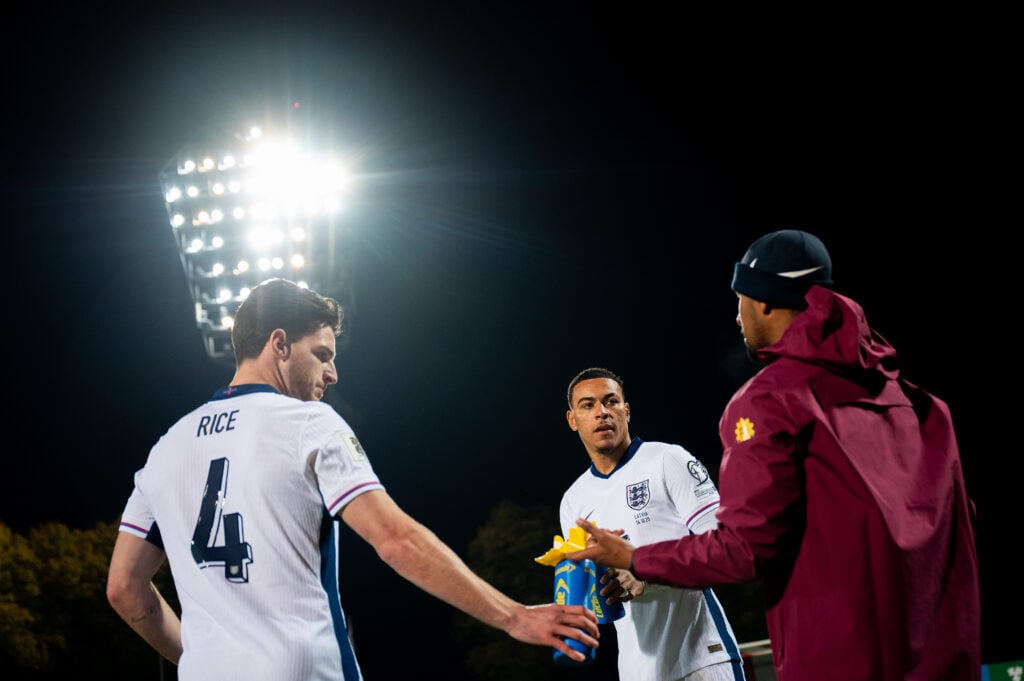 Declan Rice and Morgan Rogers getting instructions during an England game
