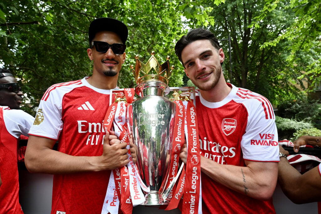William Saliba and Declan Rice pose with the Premier League title during the Arsenal Trophy Parade